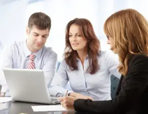Agents looking at laptop